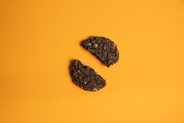 Broken cereal cookie on a colored background