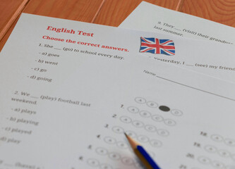 English test and bubble answer sheet on table in class