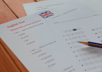English test and bubble answer sheet on table in class