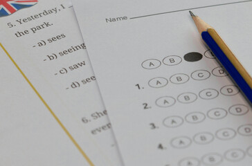 English test and bubble answer sheet on table in class