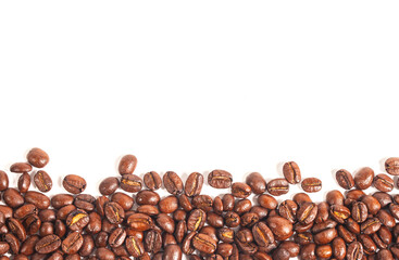 Close up of a collection of roasted coffee beans, isolated on a white background with copy space. for background illustrations and pattern designs.