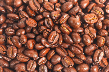 Fototapeta premium Full screen view, close up of a collection of roasted coffee beans, for background, illustration and pattern design.