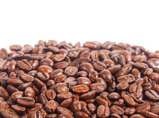 Close up of a collection of roasted coffee beans, isolated on a white background with copy space. for background illustrations and pattern designs.