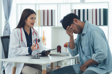 Doctor consulting worried patient in clinic 