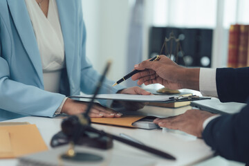 Legal Counsel: A lawyer carefully guides a client through a legal document, emphasizing the importance of legal advice in a professional setting. The image conveys trust, expertise.