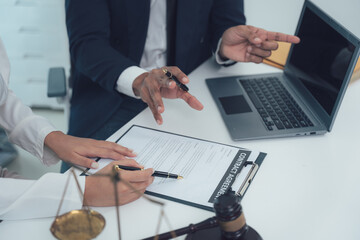 Legal Counsel: A lawyer explains the legal terms to a client, while the client signs a document. The image captures the importance of legal advice, emphasizing trust and transparency. 