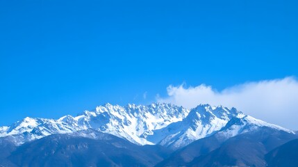 Fototapeta premium Snow-Capped Mountains Under Clear Blue Sky