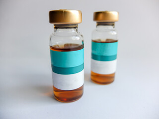 Syringe and bottle on a white background. Image of cosmetic medicine and cosmetic surgery.