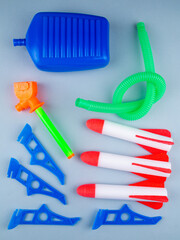 Close up of a toy with three rockets with a launcher