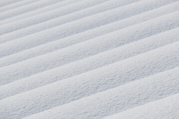 Obraz premium Abstract background of diagonal lines of pure white fresh snow in winter, Japan