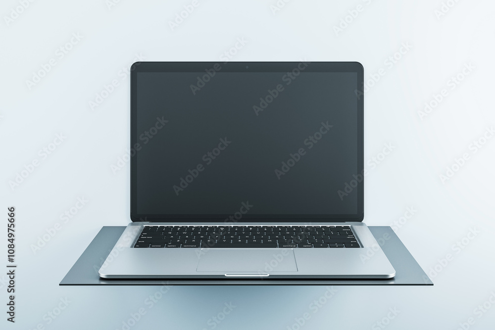 Aufkleber front view on modern laptop blank black monitor with copyspace for your logo or text on dark stand i