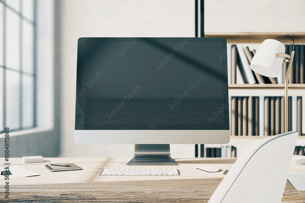 Poster Front view on blank modern computer monitor with copyspace for your text or logo on wooden table with white keyboard and stylish lamp in sunny office with bookcase on background. 3D rendering, mockup