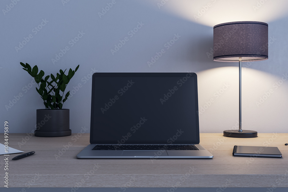 Poster Front view on blank black modern laptop screen with place for your logo or text on wooden table with flowerpot, switched on lamp and notebook. 3D rendering, mock up