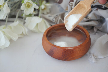 pouring Baking soda in a water bowl 