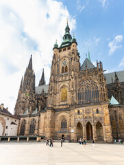 Side wall with Great bell tower of St Vitus Cathedral near the New Royal Palace in Prague in Czech Republic