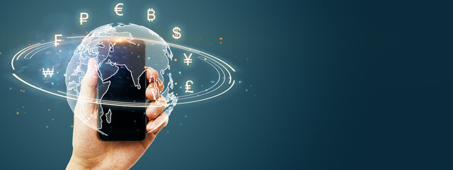 Hand holding smartphone with global currencies symbols surrounding a digital world map, symbolizing global finance and exchange.