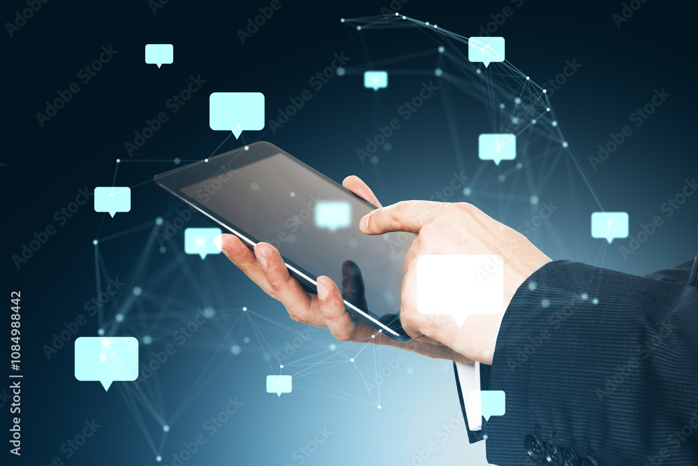 Poster Businessman using tablet with speech bubbles and network connections on dark background.