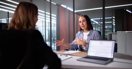Young Woman Sitting At Interview