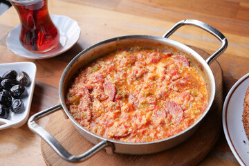 Turkish Menemen omelet in a frying pan. .