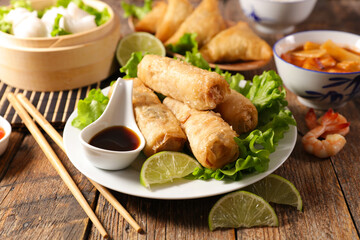 assorted of asian food. Fried spring roll, dumpling, samosa and soysauce