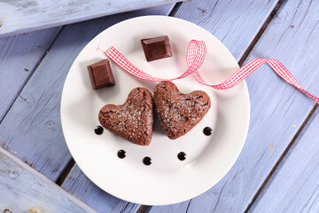 delicious heart shape chocolate cake with red ribbon