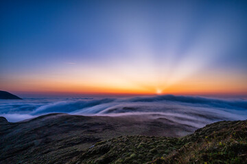 Fototapeta premium Scenery of an early morning when the sun rises over the Ireland mountain range