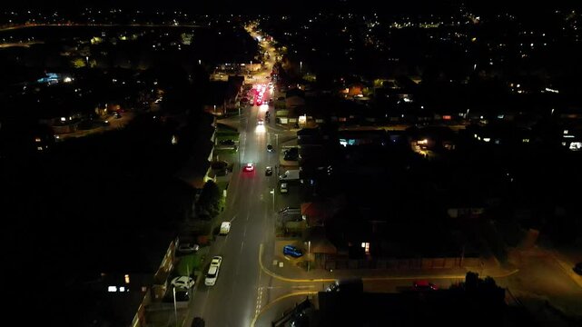Aerial Footage of Illuminated Luton City, Barton Road A6 at Cold Night. High Angle View was Captured During Rainy and Cloudy Night over England UK. Captured with Drone's Camera on November 16th, 2024