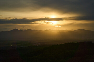 Kamchatka region. The breathtaking sunset is casting beautiful golden hues across a serene and picturesque landscape scene