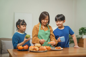 A mother and her children prepare fresh bread, milk, and fruits for breakfast, enjoying a productive and joyful morning together, creating a healthy and nourishing start to their day