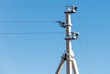 A tall pole with wires on it