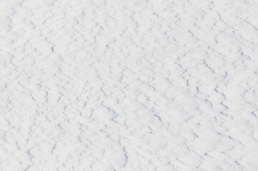 The snow is white and the ground is covered in it