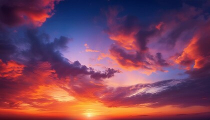 Fototapeta premium 夕日が沈み、オレンジと赤の美しいグラデーションが空を包む幻想的な風景。