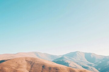 Naklejka premium Serene Mountain Landscape Under Clear Blue Sky