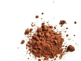 Raw cocoa powder on a white background.
