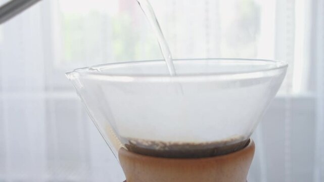 brewing coffee with coffee wooden dripper in close-up	