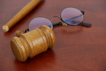 Broken gavel and round eyeglasses with copy space for text. Concept of lawlessness, injustice and...
