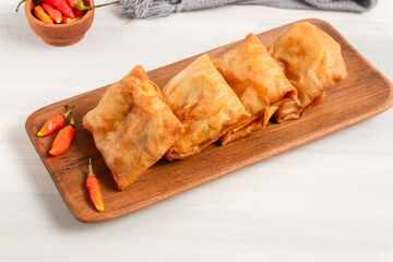 Martabak Tahu or Tofu Spring Rolls. Is traditional snacks in Indonesia.perfect for recipe, article, catalogue, or any commercial purposes. with copy space.