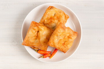 Martabak Tahu or Tofu Spring Rolls. Is traditional snacks in Indonesia.perfect for recipe, article, catalogue, or any commercial purposes. with copy space.