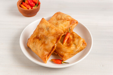 Martabak Tahu or Tofu Spring Rolls. Is traditional snacks in Indonesia.perfect for recipe, article, catalogue, or any commercial purposes. with copy space.