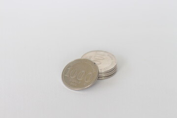 Silver coins stacks isolated on a white background. Indonesian rupiah coin. 1000 rupiah coin. metal money