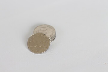 Silver coins stacks isolated on a white background. Indonesian rupiah coin. 1000 rupiah coin. metal money