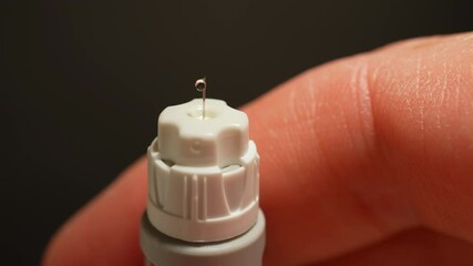 Diabetes management injection pen needle close up. Semaglutide drug dose syringe in macro view. Anti diabetic medication for treatment of type 2 diabetes and anti-obesity medicine.