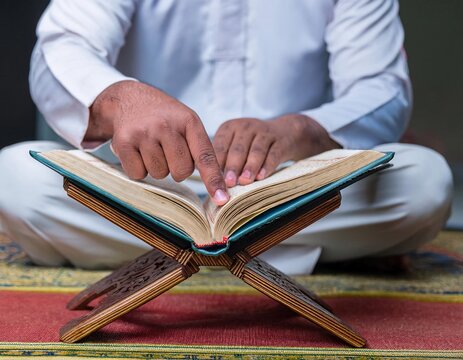 a Muslim holding the Koran, reflects religious values, tranquility, and spiritual connection