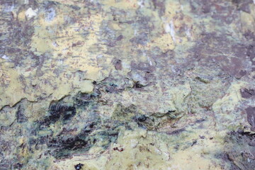Fototapeta premium A Beautifully Textured Natural Stone Surface Showcasing a Variety of Earthy Tones and Colors