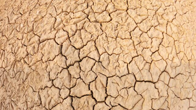 Draught land of Kutch desert. Natural pattern of desert land. Cracked, dry soil due to lack of water and hot weather in Little Rann of Kutch, Gujarat. Dehydrated and barren land during summer season
