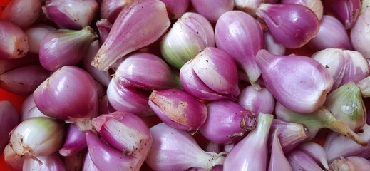 Peeled of fresh red onions Sumenep or bawang merah Sumenep background Indonesia. Ready to cooked