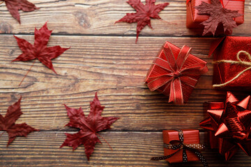 Assorted artisanal gift boxes on wooden background.