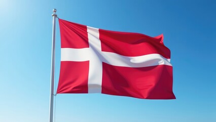 The flag of Denmark billows in the wind against a clear blue sky. Concept of Danish national identity and pride.