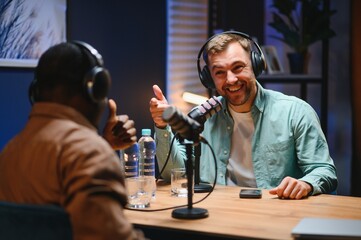 Show host and guest meeting to stream podcast episode together, creating online content with live...