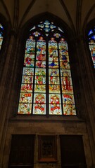 image of stained glass windows of a Gothic cathedral. Stained glass windows are present in churches...
